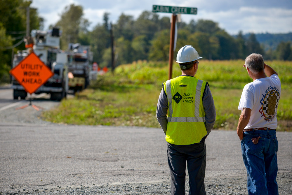 PSE employee speaking with landowner